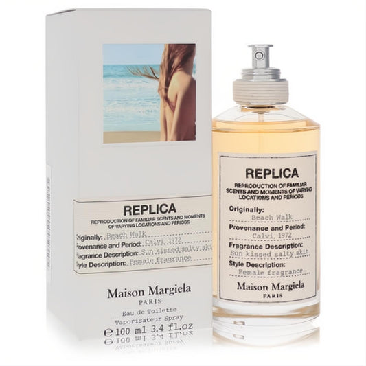 Maison Margiela Replica Beach Walk 3.4 oz EDT: elegant clear glass bottle with warm amber liquid, silver cap, and iconic white label, beside its minimalist box.
