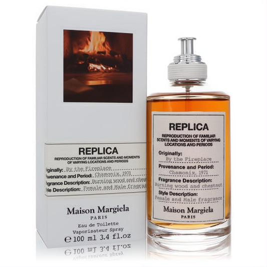 Replica By the Fireplace perfume bottle and box. Amber fragrance in a clear glass bottle with a white label and silver cap.