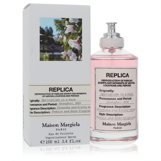Experience Replica Springtime in a Park 3.4 oz EDT: a pink fragrance in a sleek glass bottle with its elegant white floral box.