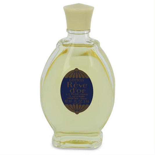 Classic Reve D'or 3.25 oz women's cologne splash. Clear glass bottle, golden liquid, cream cap, and elegant blue-gold label.