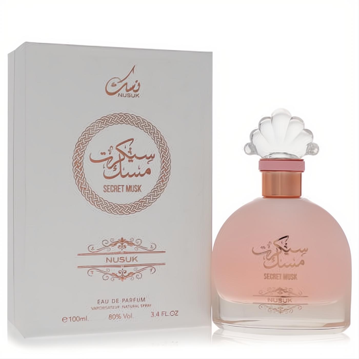 Captivating Rihanah Secret Musk 3.4 oz EDP. Frosted pink bottle, elegant shell cap, rose gold accents, and matching white box.
