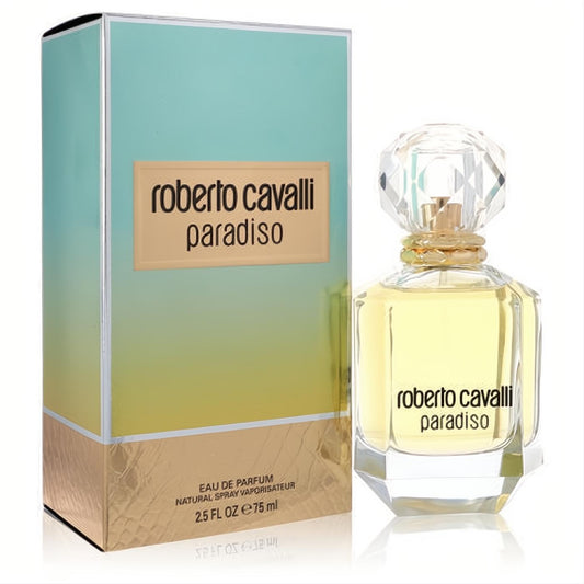 Radiant Roberto Cavalli Paradiso 2.5 oz EDP with clear bottle, golden liquid, sparkling faceted cap, beside its vibrant blue-gold box.