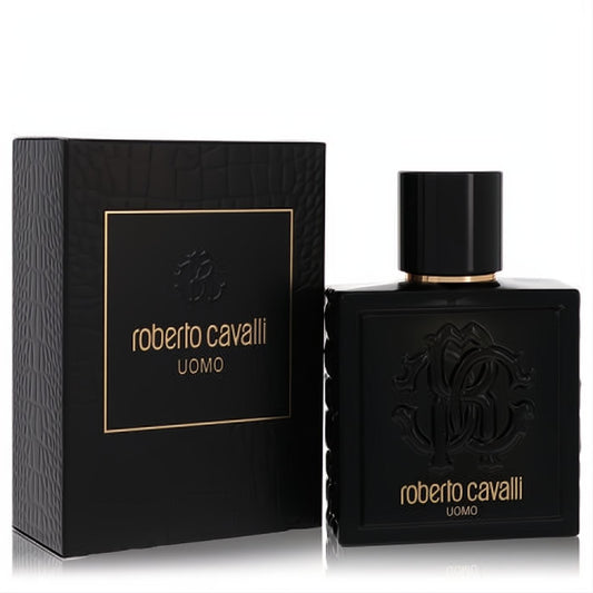 Luxurious Roberto Cavalli Uomo 3.4 oz EDT in a black bottle with gold trim, embossed RC logo, and matching crocodile-textured box.