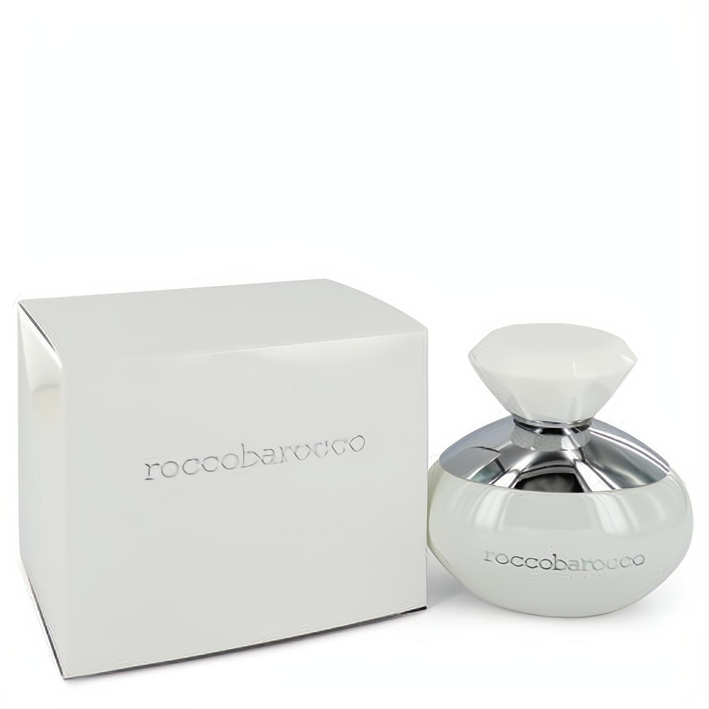 Elegant Roccobarocco White women's perfume bottle, white with a silver accent and faceted gem-like cap, next to its sleek matching box.