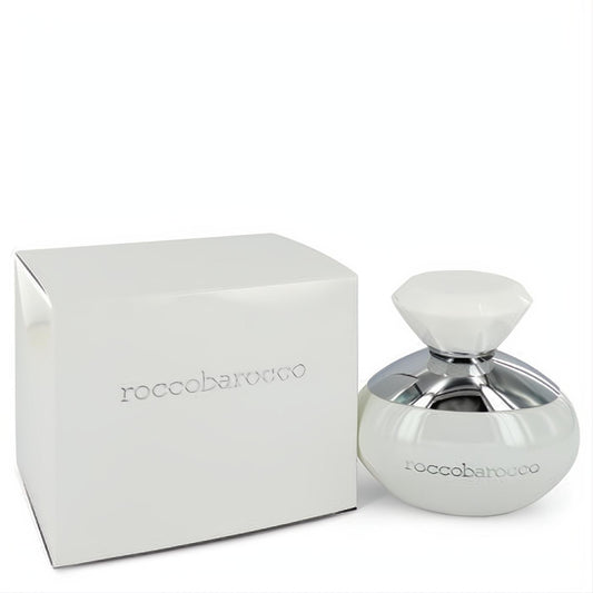 Elegant Roccobarocco White women's perfume bottle, white with a silver accent and faceted gem-like cap, next to its sleek matching box.
