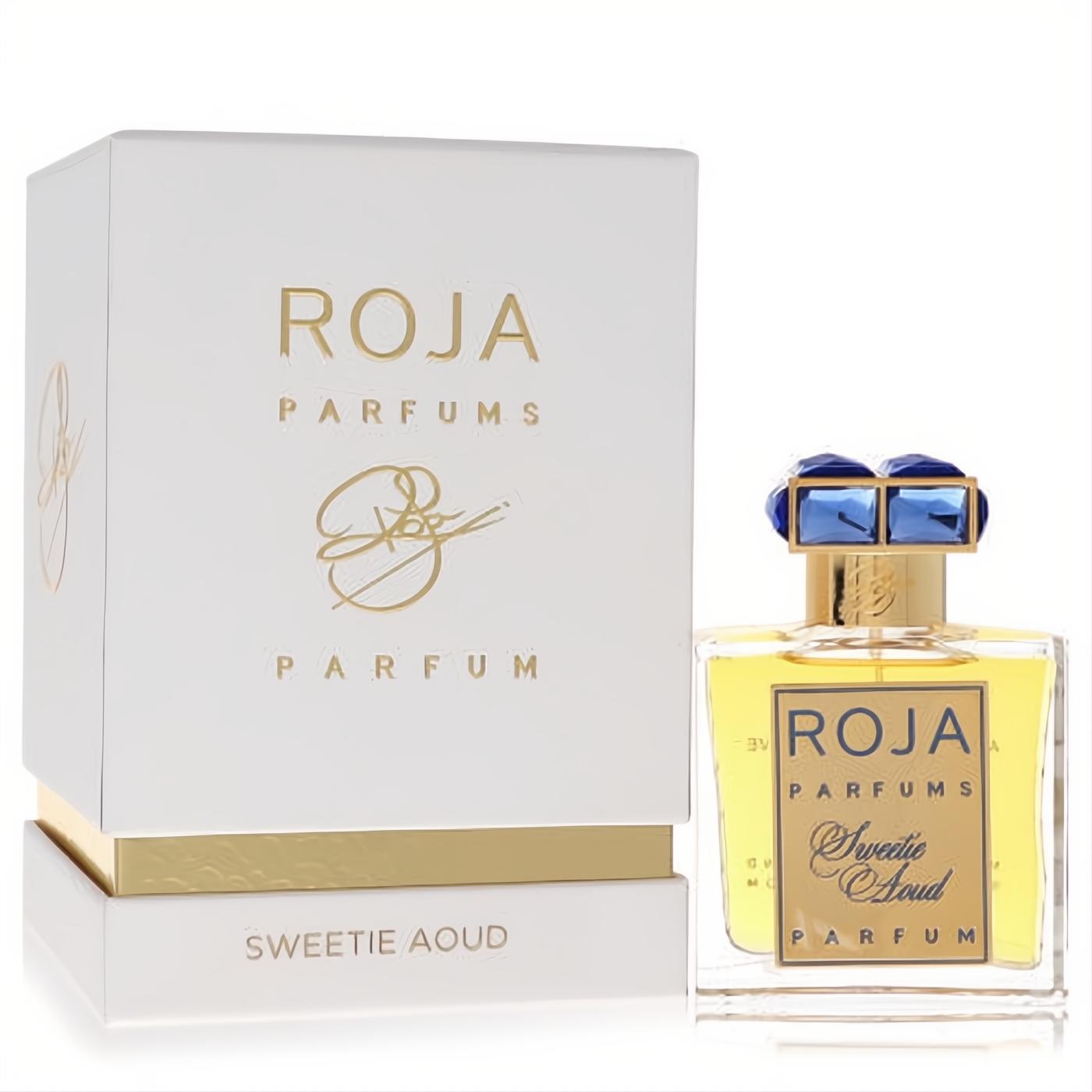 Exquisite Roja Sweetie Aoud 1.7 oz unisex perfume in a clear bottle with a dazzling blue jeweled cap and elegant white gold box.