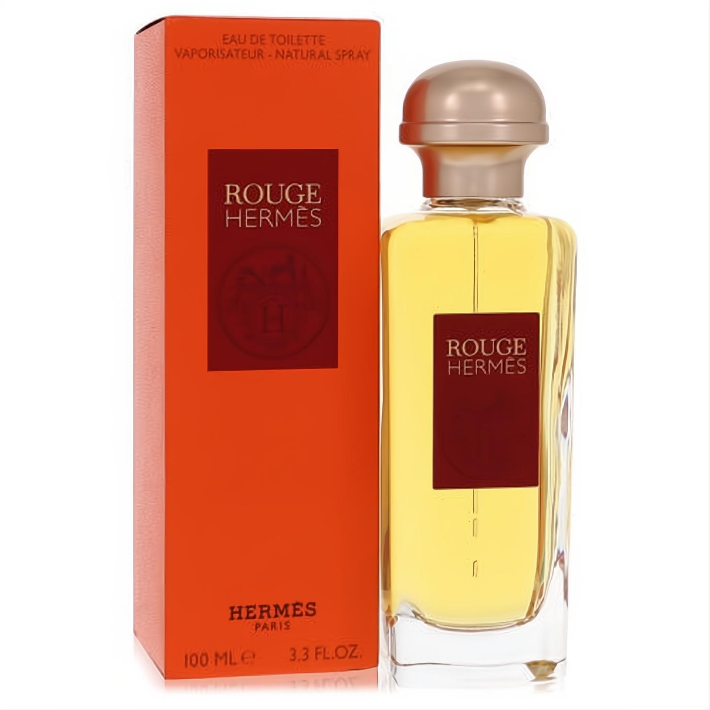 Luxurious Hermes Rouge Eau De Toilette 3.3 oz for women. Clear glass bottle, elegant rose gold cap, and vibrant red box.