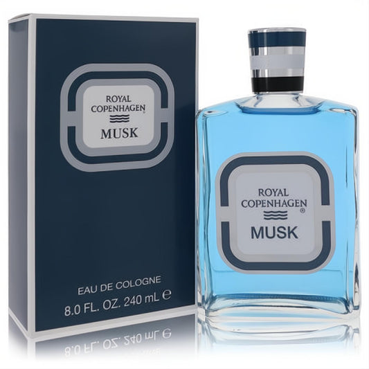 Elegant Royal Copenhagen Musk 8 oz cologne in a clear glass bottle with light blue liquid, dark blue cap, and matching box. Classic masculine scent.