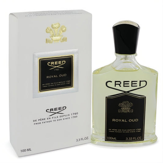 Luxurious Creed Royal Oud 3.3 oz unisex Eau De Parfum spray bottle with amber liquid and sleek black cap, beside its elegant white and gold box.