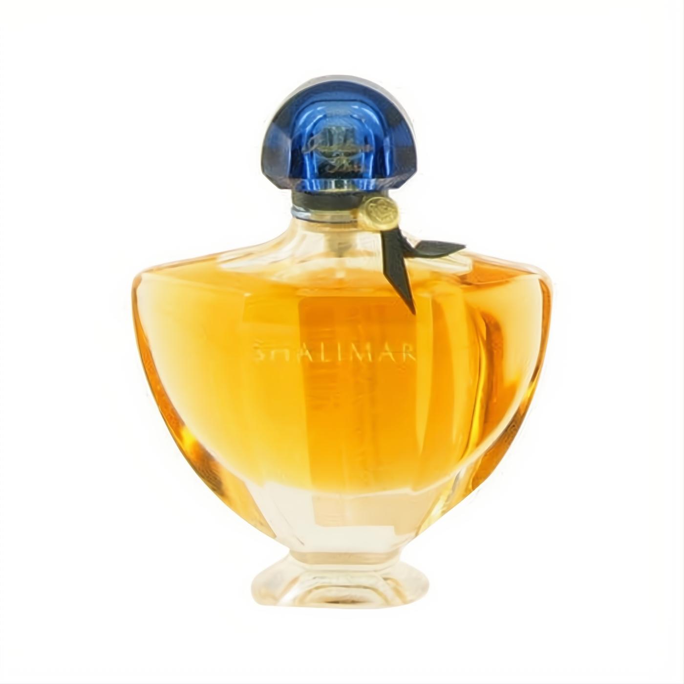 Guerlain Shalimar 3 oz EDP tester. Elegant clear glass bottle with golden liquid, deep blue cap, and chic black ribbon detail.