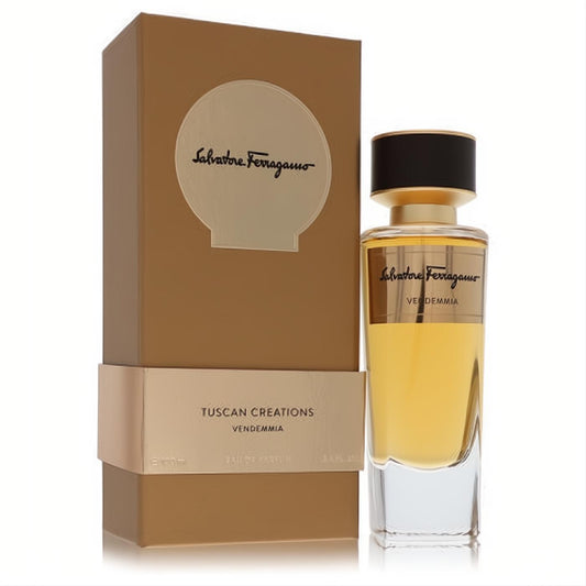 Salvatore Ferragamo Vendemmia 3.3 oz unisex EDP spray. Elegant clear glass bottle with golden fragrance, beside its luxurious golden-brown box.
