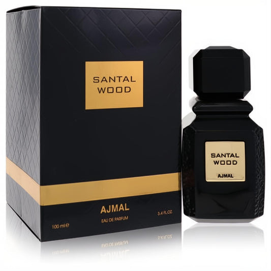 Ajmal Santal Wood 3.4 oz unisex Eau De Parfum. Sleek black bottle with geometric cap and gold label, beside a matching textured black and gold box.