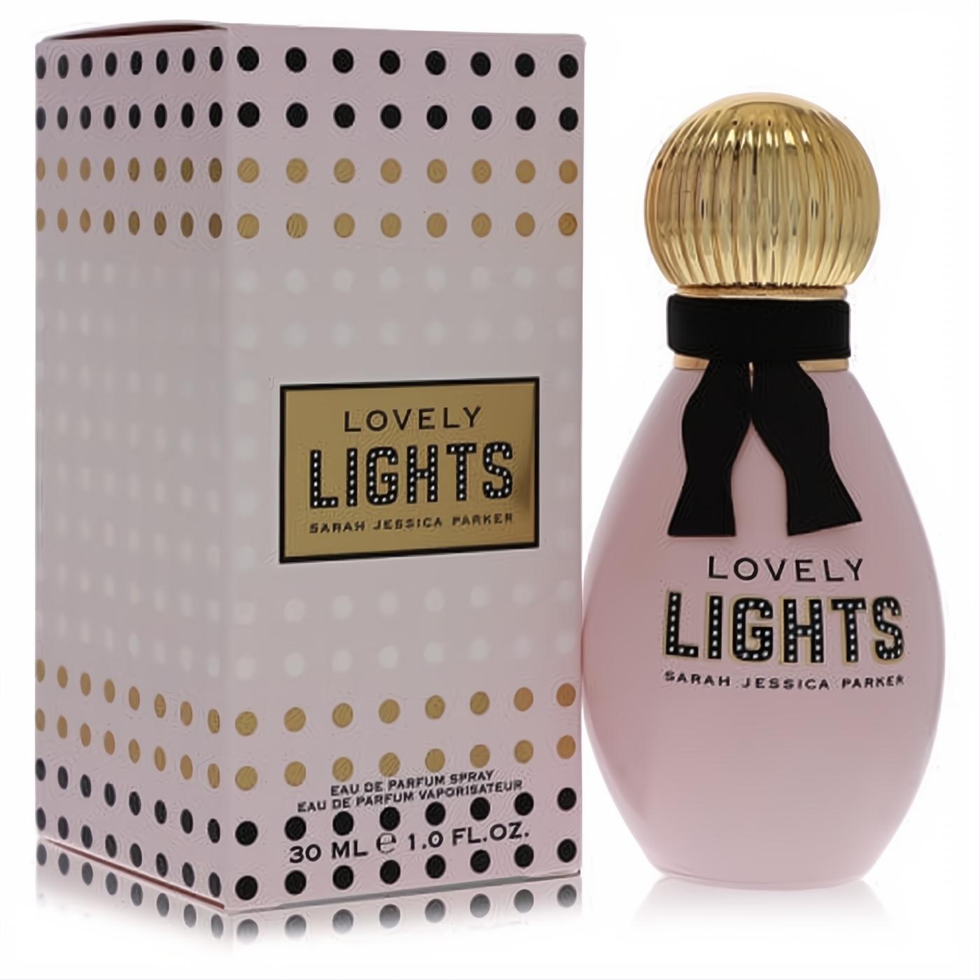 Lovely Lights SJP 1 oz EDP features a blush pink bottle, elegant gold ribbed cap, black ribbon bow, and a playful polka dot box.