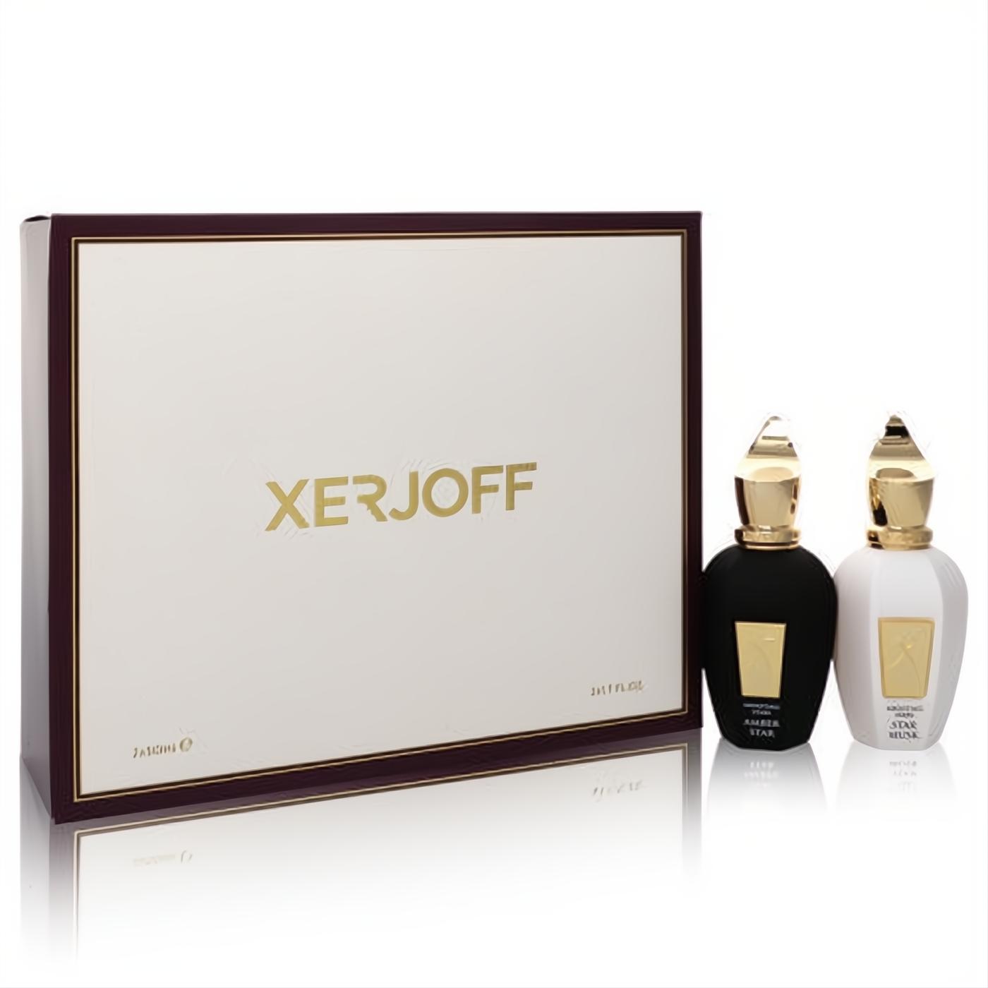 Xerjoff Shooting Stars Amber Star & Star Musk gift set. Two elegant 1.7 oz black and white EDP bottles with gold caps, beside a cream and gold box.