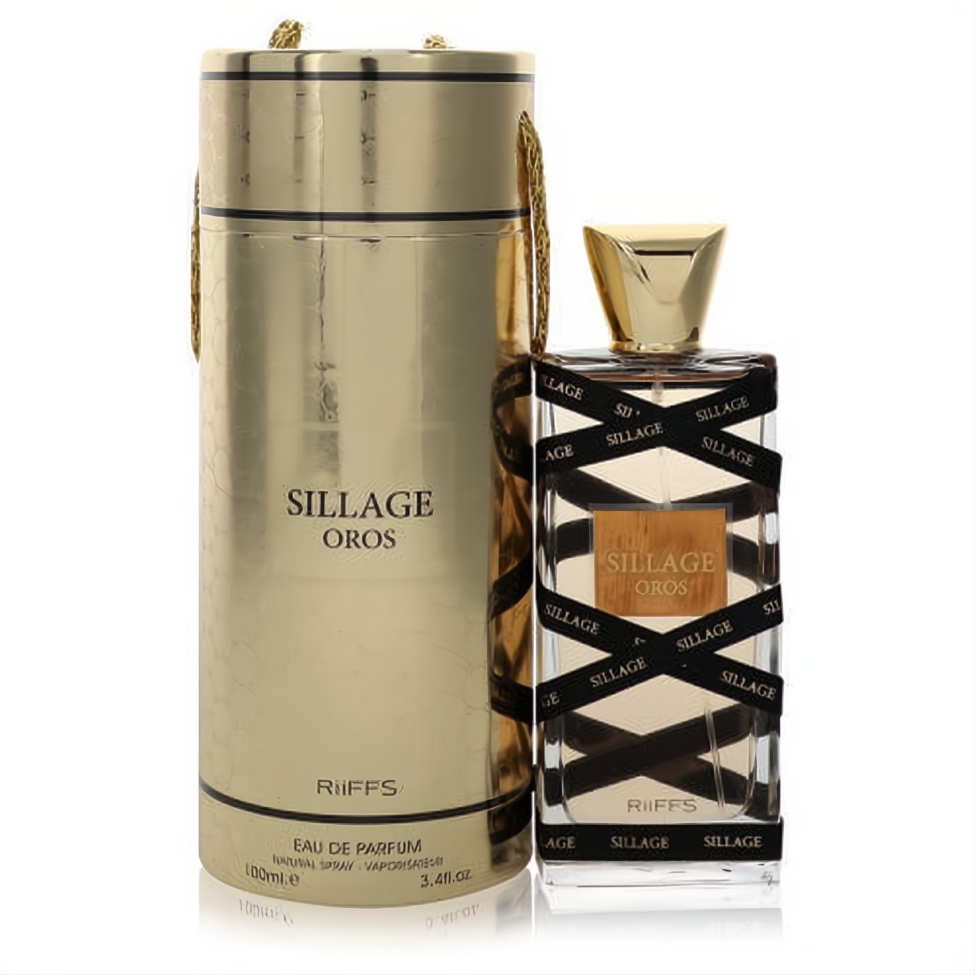 Luxurious Sillage Oros 3.4 oz unisex EDP. Gold textured gift box and clear bottle with bold black SILLAGE ribbon design.