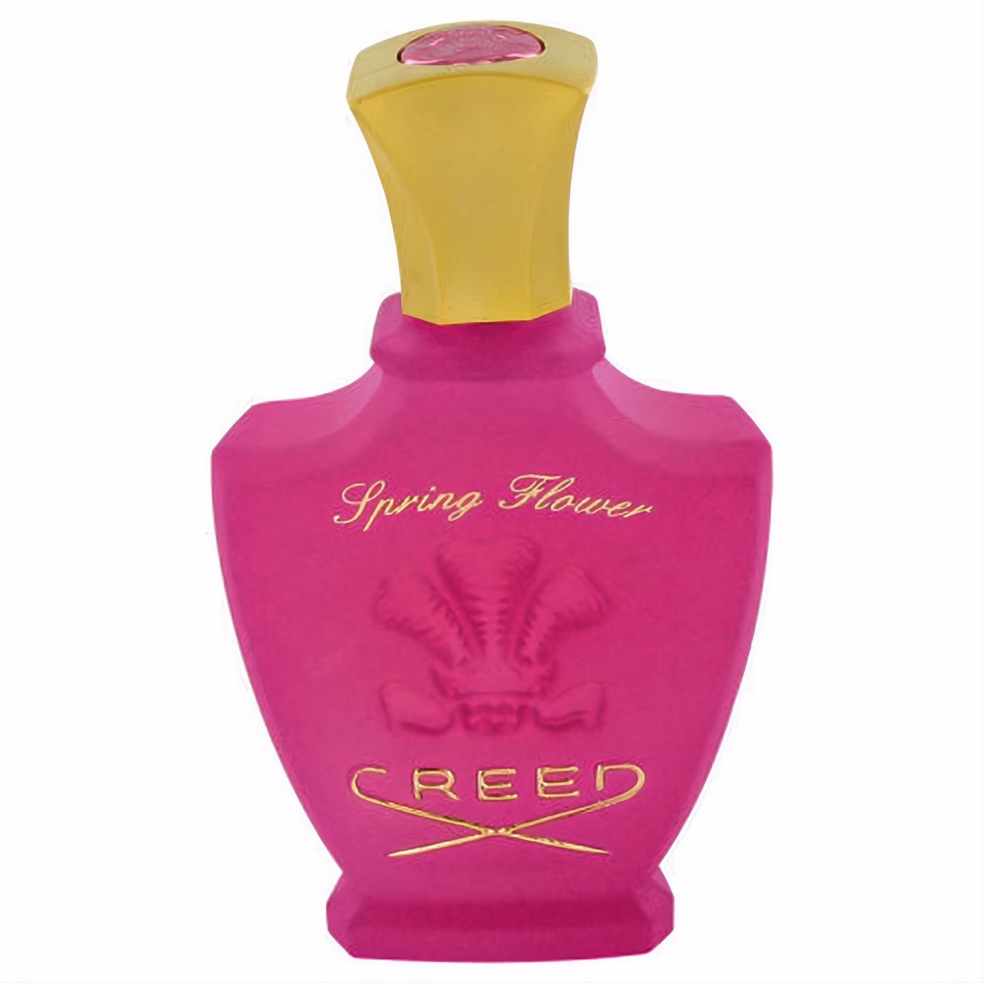 Vibrant fuchsia pink Creed Spring Flower perfume bottle. Features elegant gold cap, script text, and iconic Creed logo. Luxurious women's fragrance.