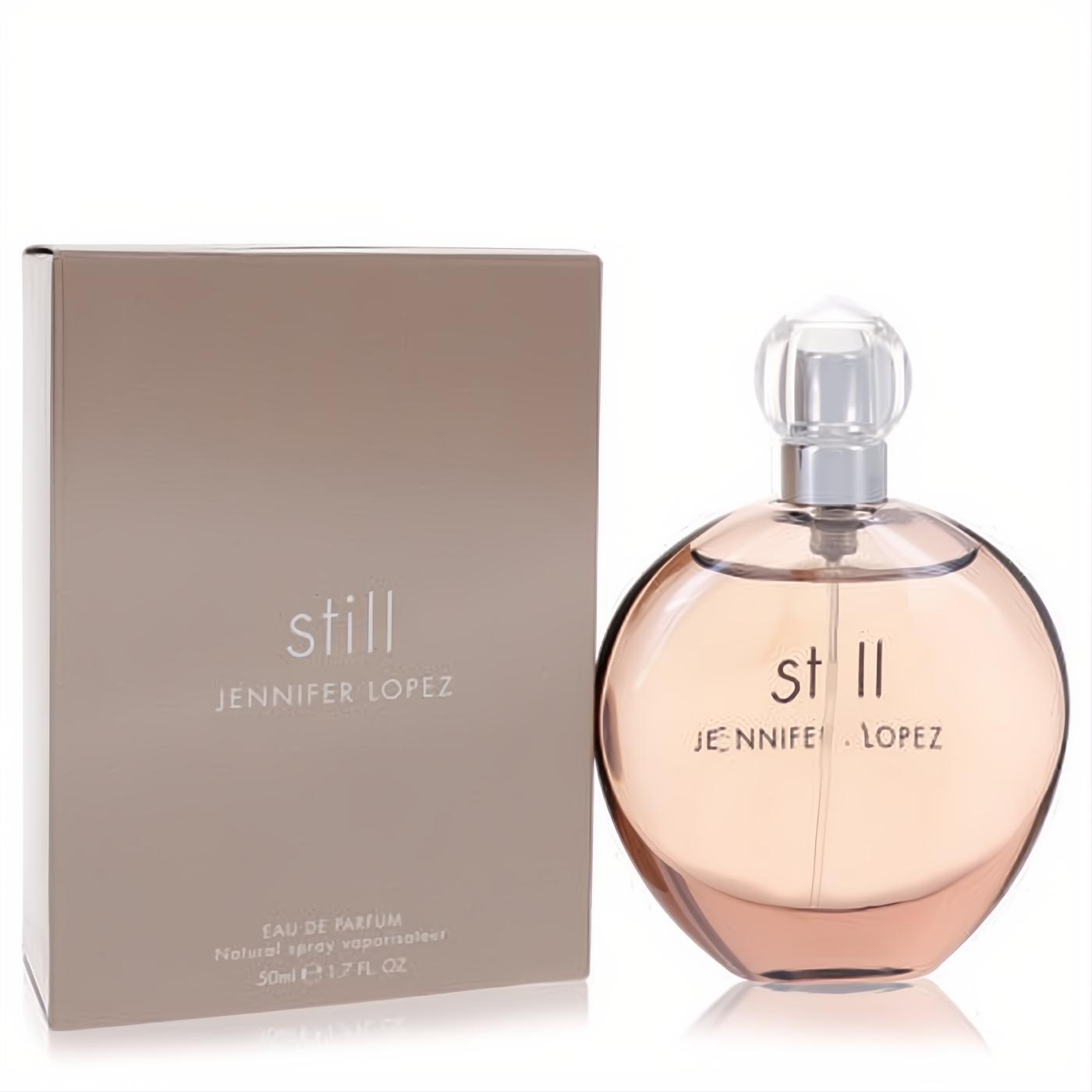 Elegant round glass bottle of Still by Jennifer Lopez 1.7 oz Eau De Parfum with light peach liquid and matching taupe box.