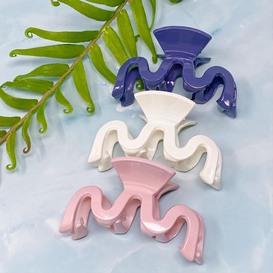 Style Wave set of 3 unique hair claws: chic purple, white, and pink. Medium-to-large capacity for a secure, stylish hold.