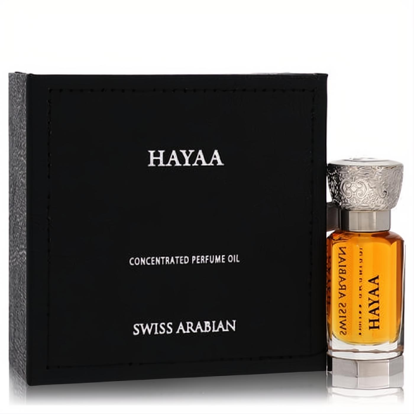 Luxurious Swiss Arabian Hayaa unisex concentrated perfume oil. Amber liquid in a glass bottle with an ornate silver cap, beside its black box.
