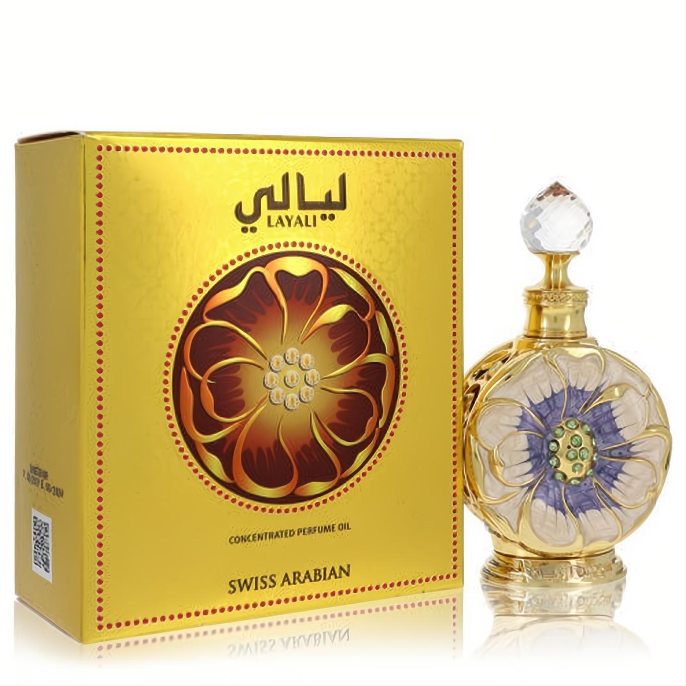 Exquisite Swiss Arabian Layali perfume oil. Ornate gold bottle with white-lavender floral design, green gems, crystal stopper, and matching gold box.