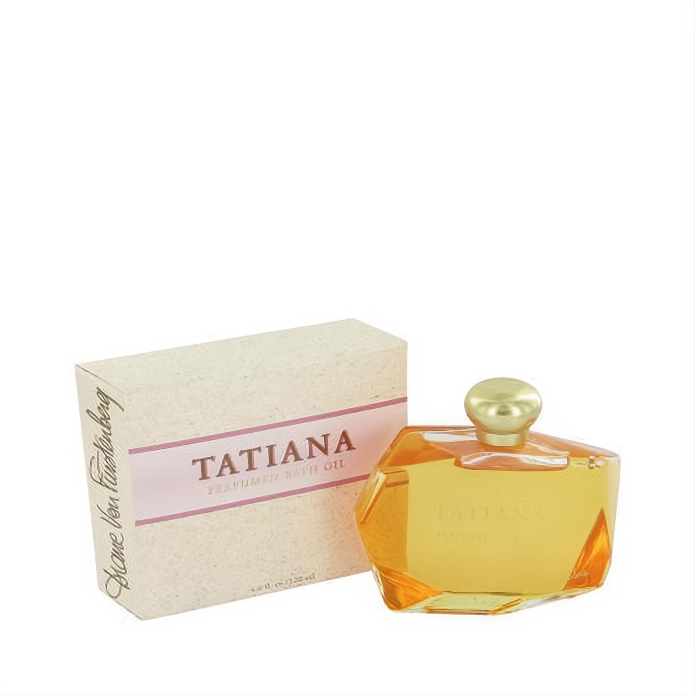 Luxurious TATIANA 4 oz perfumed bath oil in a faceted amber glass bottle with a gold cap, beside its elegant beige and pink box.