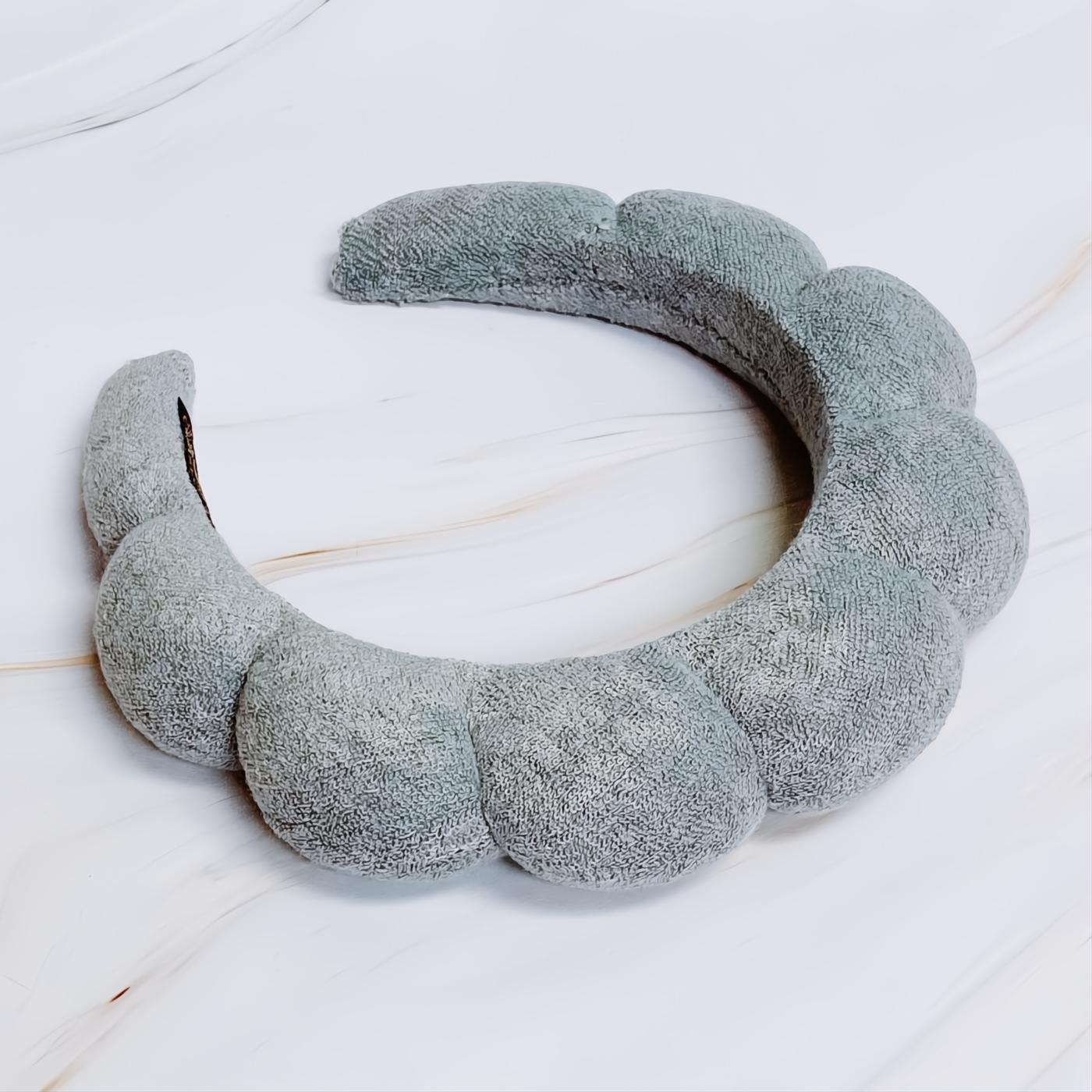 Soft gray terry cloth headband featuring a playful puffy scalloped design. Enjoy ultimate comfort and style.