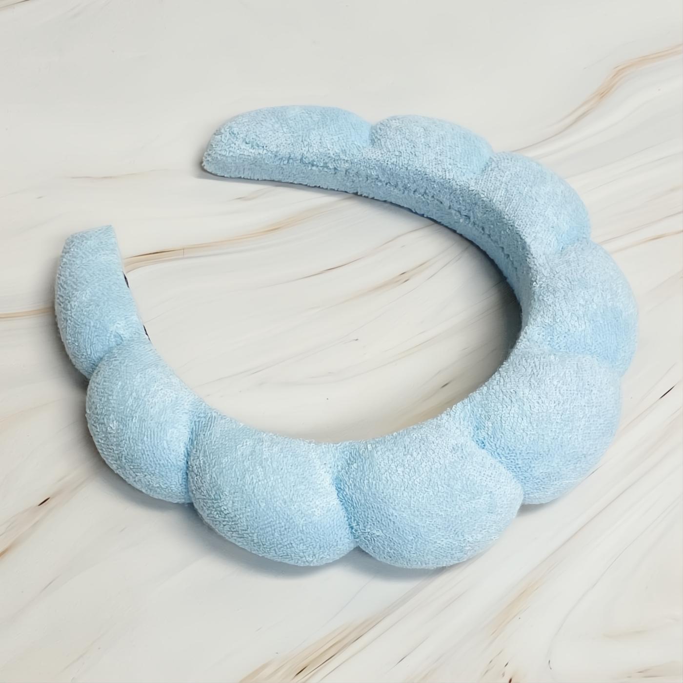 Indulge in comfort with this soft baby blue terry cloth headband, boasting a stylish puffy scalloped design.
