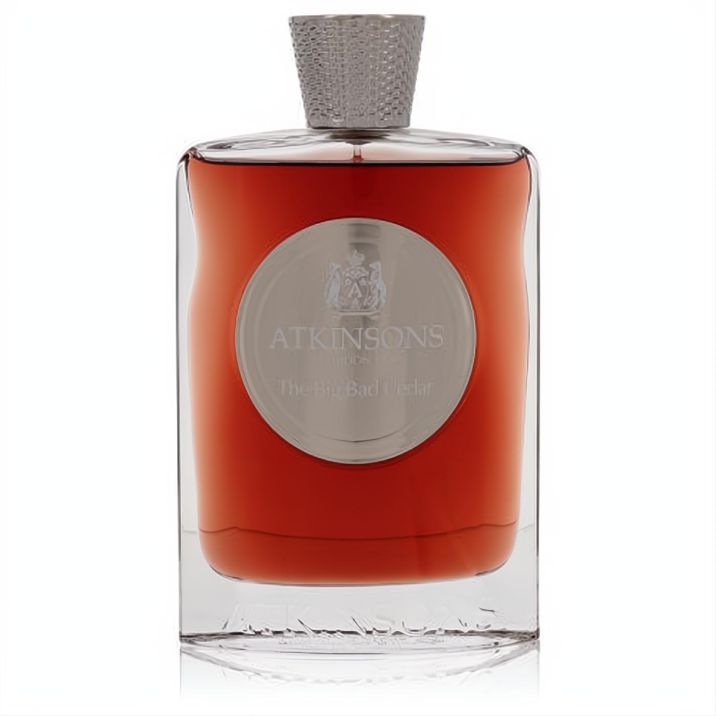 Atkinsons The Big Bad Cedar EDP in an elegant clear glass bottle with rich amber liquid, a silver circular label, and a textured silver cap.