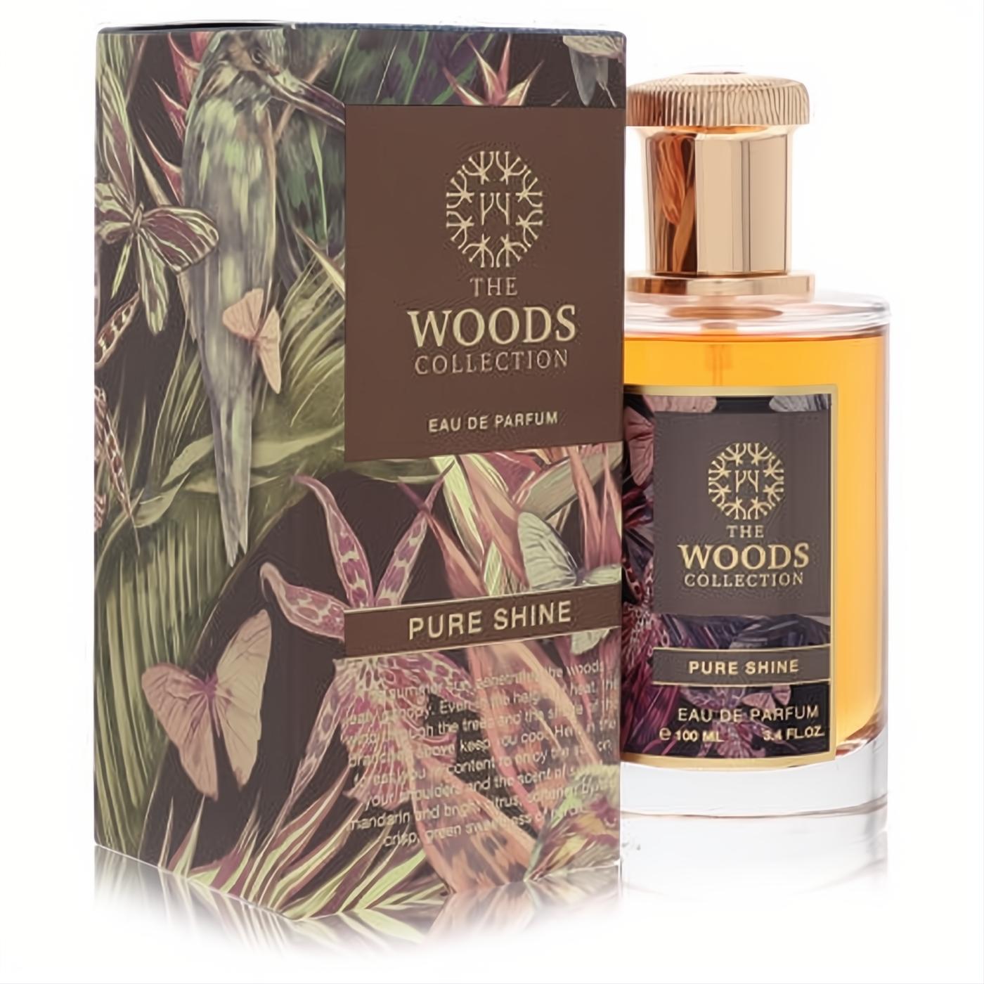 Captivating The Woods Collection Pure Shine 3.4 oz unisex Eau De Parfum. Amber liquid, gold cap, and lush tropical forest box.