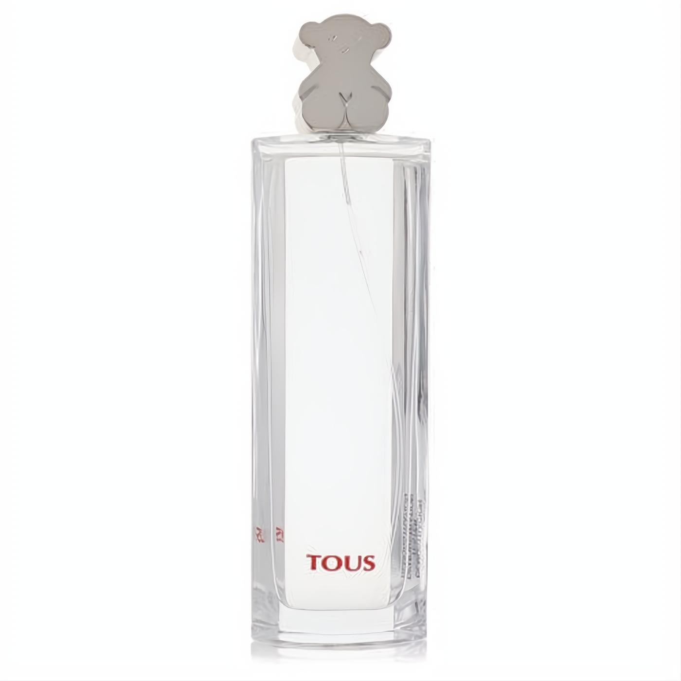Tous Eau De Toilette spray in a sleek clear glass bottle, featuring an iconic silver bear cap and red TOUS logo.