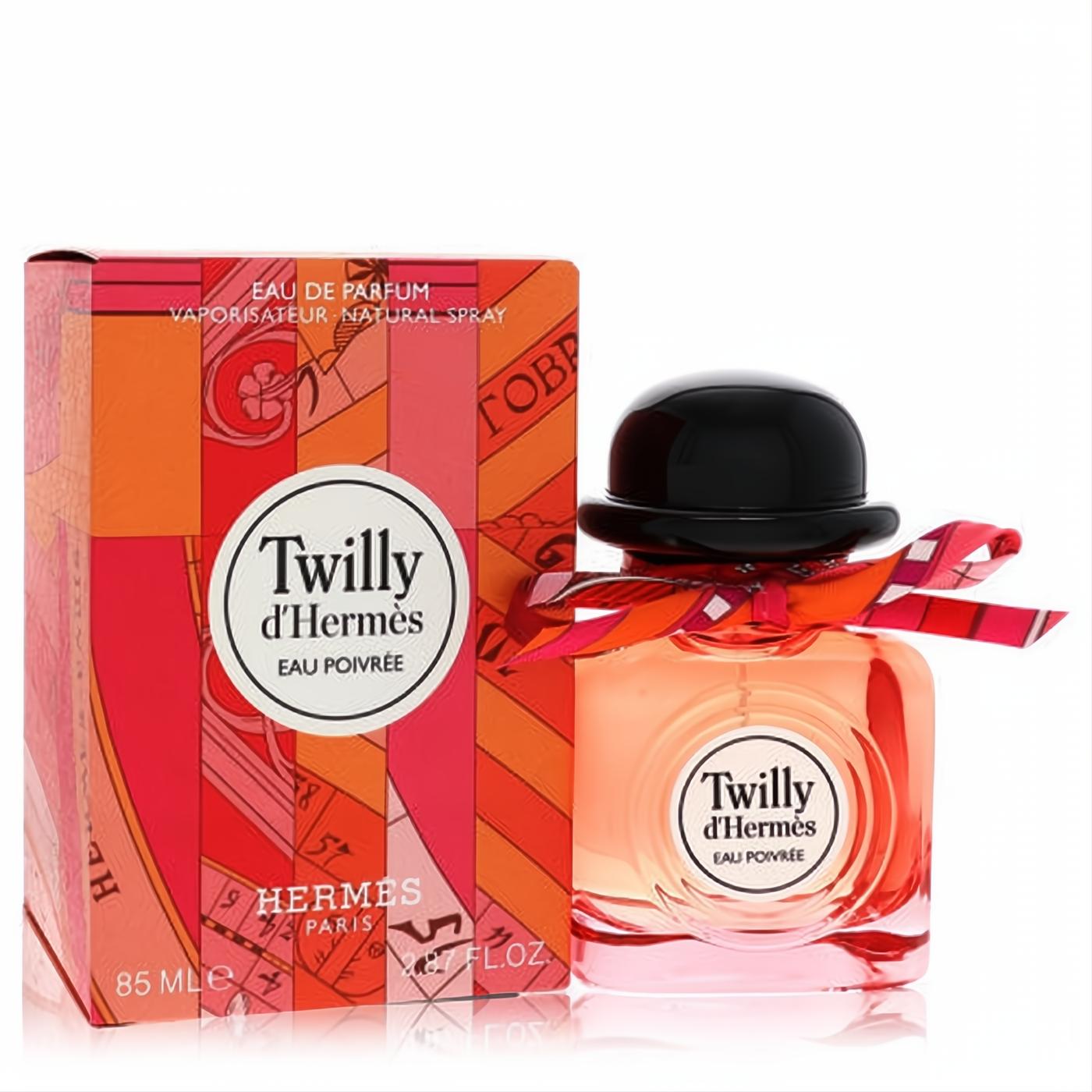 Twilly D'Hermes Eau Poivree 85ml EDP. Clear bottle with chic black hat cap, vibrant ribbon, and matching orange & pink box.