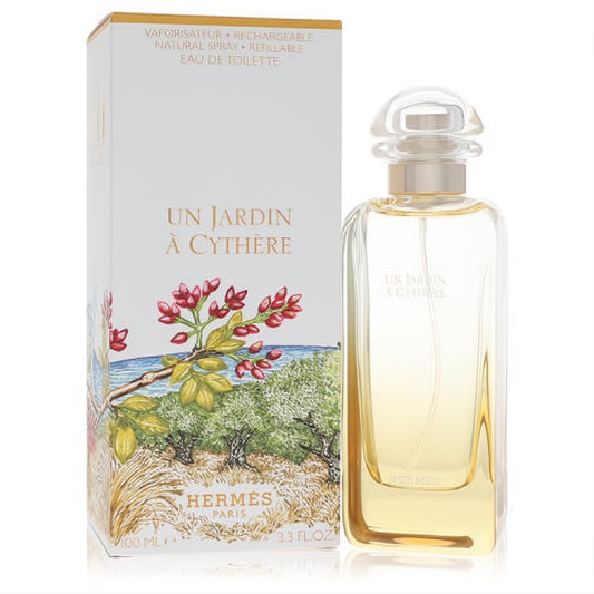Hermes Un Jardin A Cythere 3.3 oz refillable EDT. Clear glass bottle with golden liquid, vibrant Mediterranean landscape box.