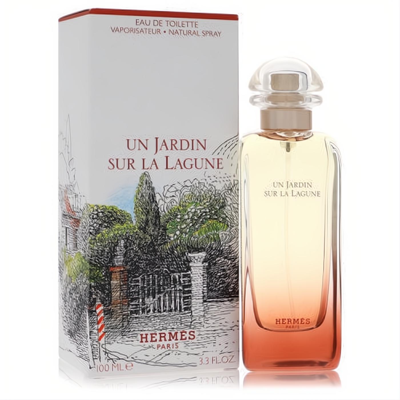Hermes Un Jardin Sur La Lagune 3.3 oz EDT. Luxurious glass bottle with warm orange liquid, next to its scenic illustrated white box.