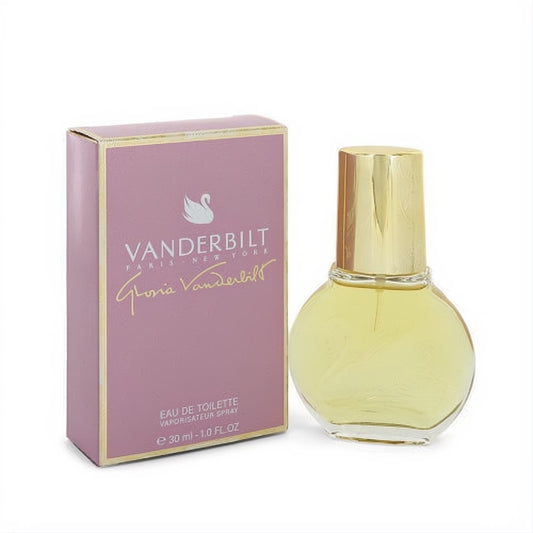 Classic Vanderbilt 1 oz EDT spray. Clear glass bottle with gold cap and swan detail, beside its elegant pink and gold box.