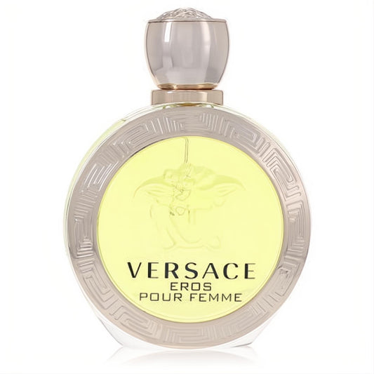 Versace Eros Pour Femme Eau De Toilette spray. Round clear bottle with iconic Medusa logo, Greek key trim, and luminous yellow liquid.