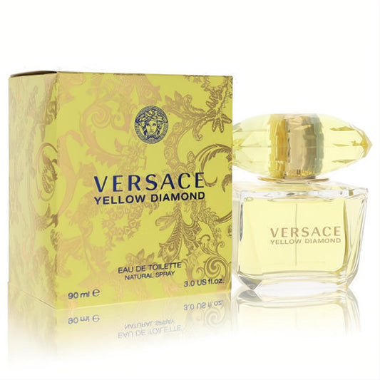 Elegant Versace Yellow Diamond 3 oz EDT in a clear bottle with sparkling yellow diamond cap, beside its luxurious gold-patterned yellow box.