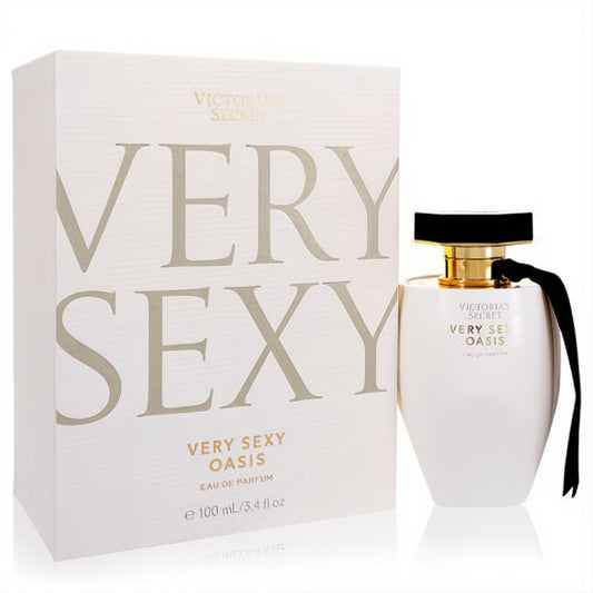 Victoria's Secret Very Sexy Oasis 3.4 oz EDP. Elegant white bottle with black cap, gold accents, and ribbon, displayed with its matching box.