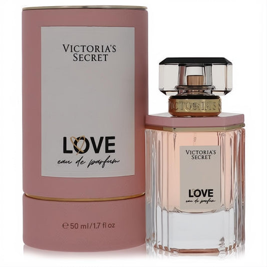 Victoria's Secret Love 1.7 oz EDP. Elegant clear faceted bottle with soft pink liquid, gold accents, and chic matching pink box.