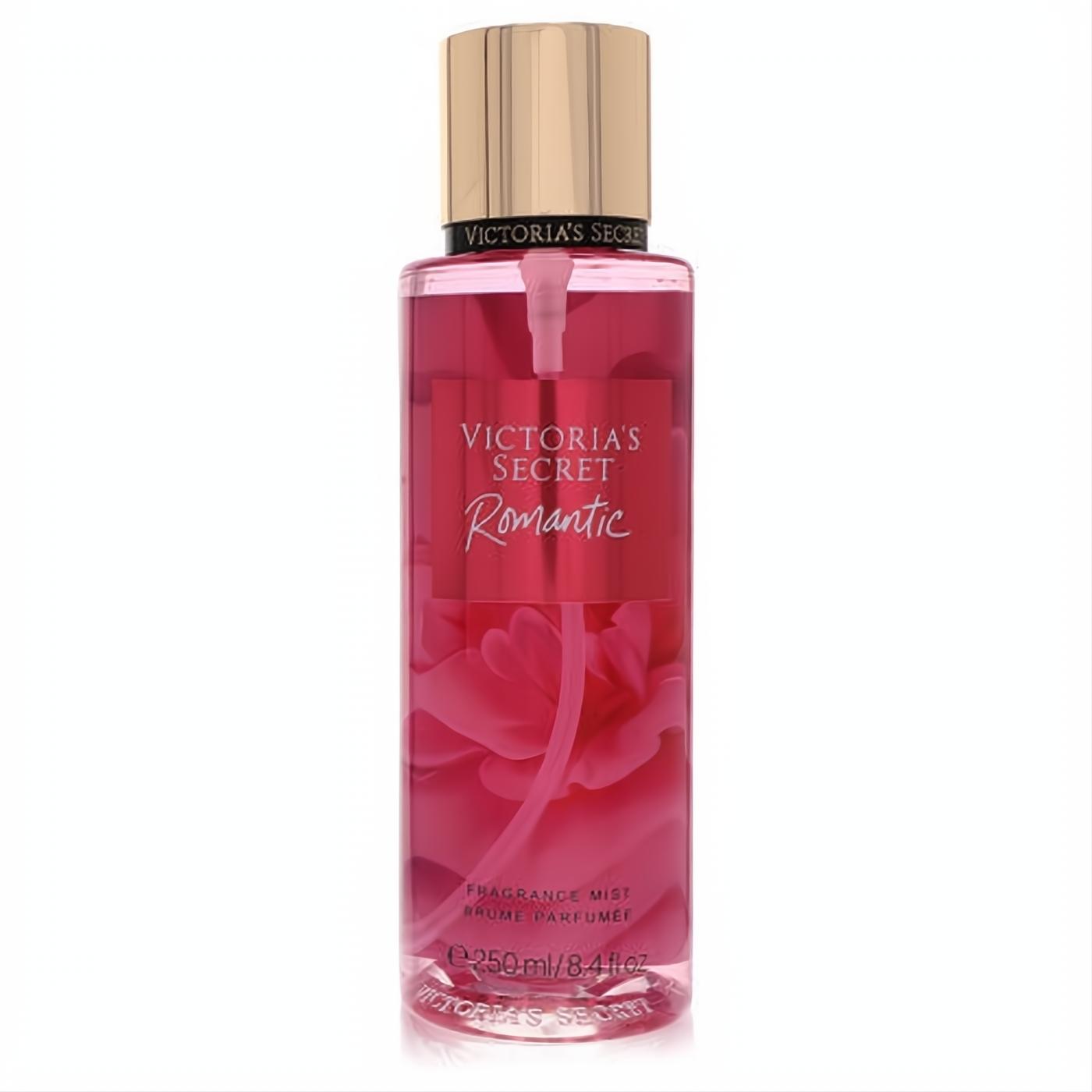 Victoria's Secret Romantic 8.4 oz fragrance mist. Clear bottle with vibrant pink liquid, luxurious gold cap, and elegant floral design.