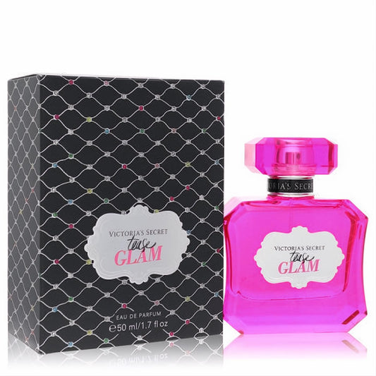 Vibrant fuchsia Victoria's Secret Tease Glam 1.7 oz EDP bottle with faceted cap and sparkling black patterned box.