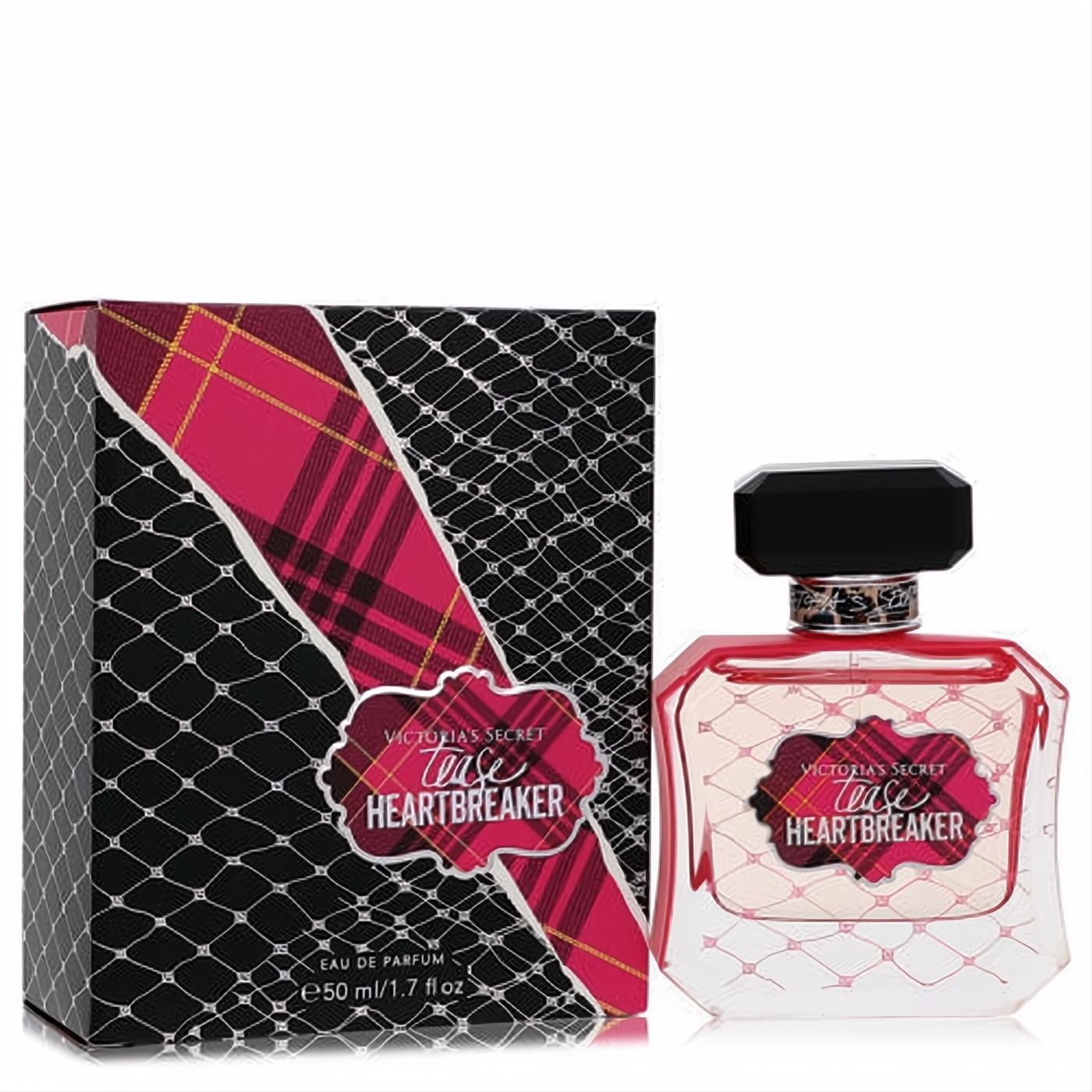 Victoria's Secret Tease Heartbreaker 1.7 oz EDP. Clear bottle with vibrant red liquid, black cap, and bold red plaid label. Matching black and red plaid box.