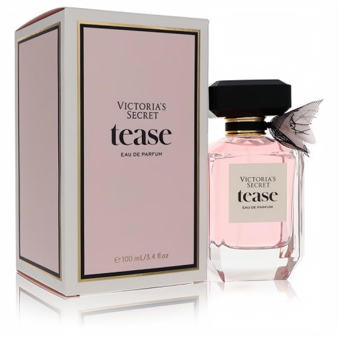 Victoria's Secret Tease 3.4 oz EDP: elegant pink bottle, black faceted cap, delicate sheer bow, and chic pink/gold box.