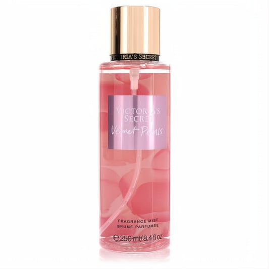Victoria's Secret Velvet Petals 8.4 oz women's fragrance mist. Clear bottle, alluring pink liquid, chic gold cap.
