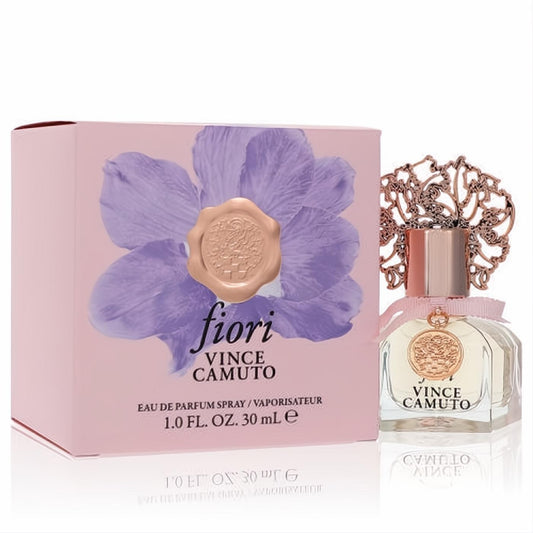 Elegant Vince Camuto Fiori 1 oz EDP perfume: clear glass bottle, rose gold cap, ornate filigree, pink ribbon, and matching floral box.