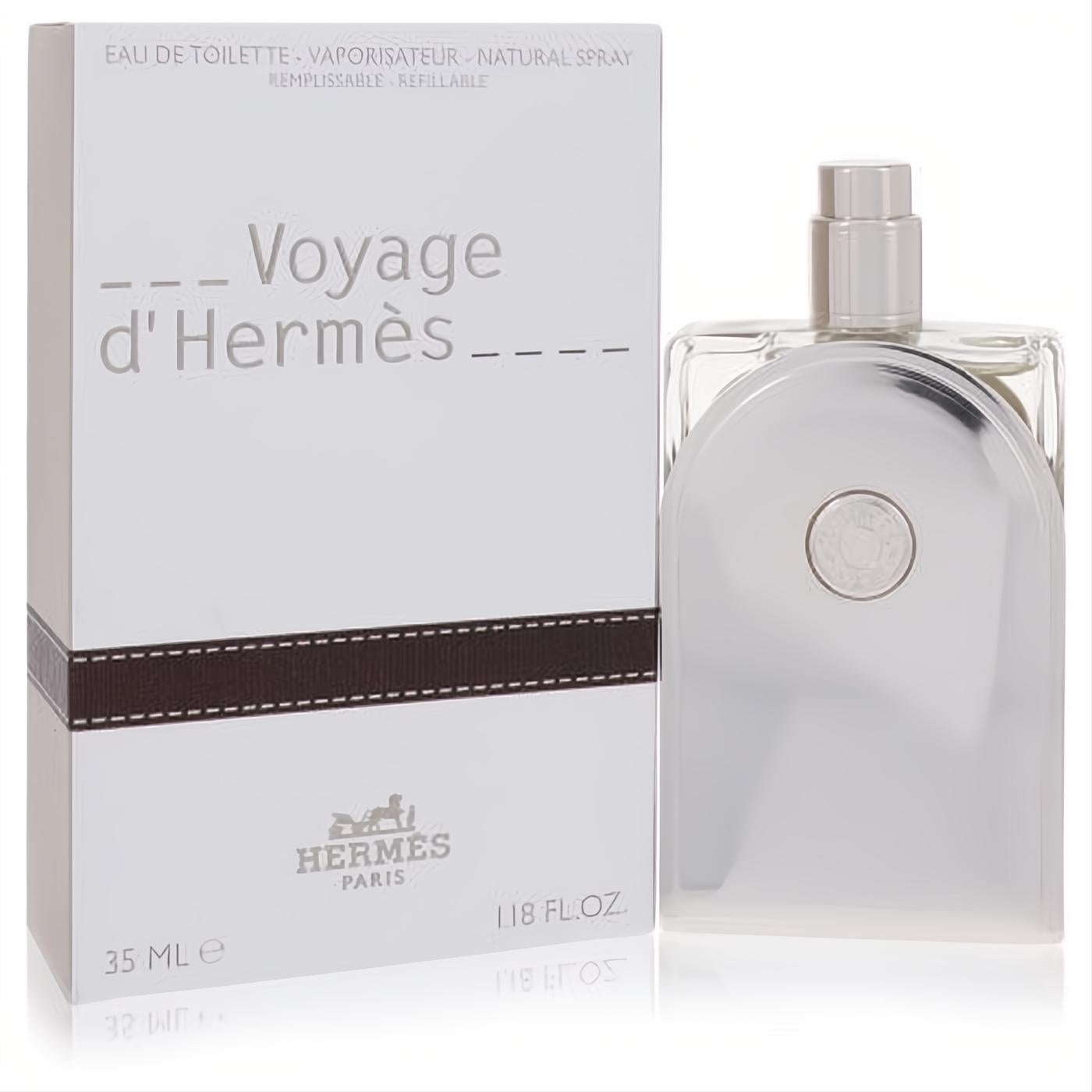 Voyage d'Hermès 1.18 oz unisex EDT spray. Sleek silver refillable bottle with iconic Hermes logo, next to its elegant white and brown box.