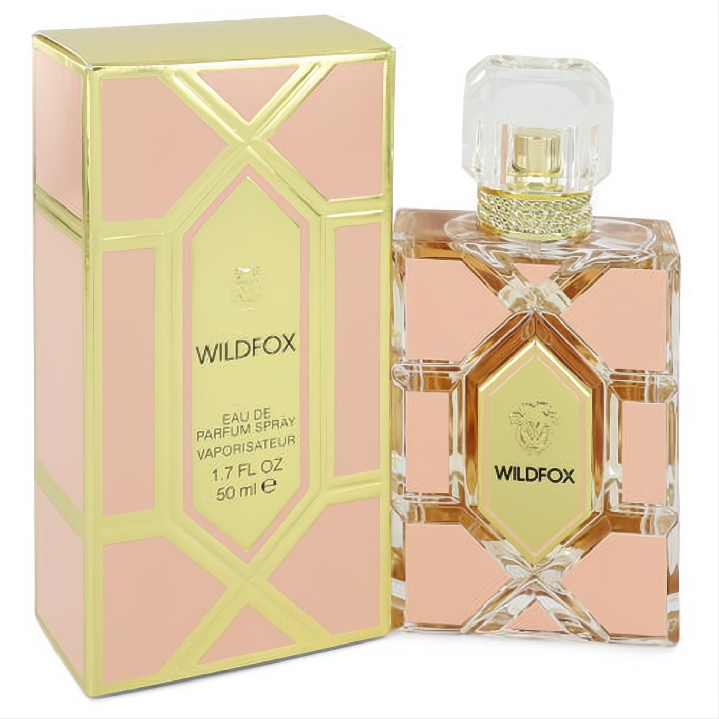 Luxurious Wildfox 1.7 oz Eau De Parfum spray in a clear, faceted peach and gold geometric bottle with a sparkling cap and matching box.
