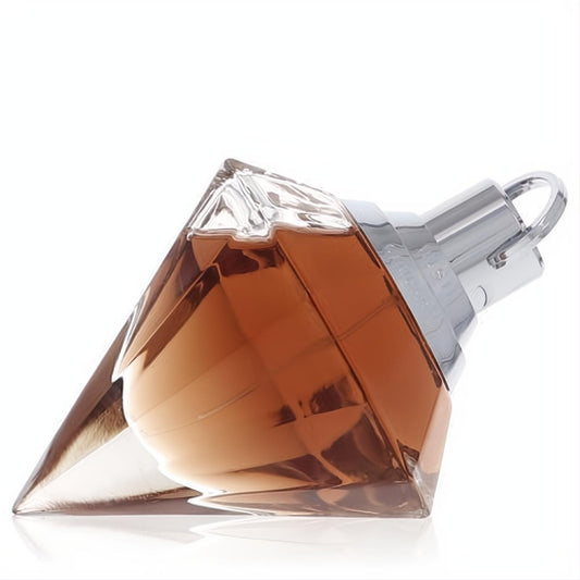 Chopard Wish women's perfume in a sparkling diamond-cut glass bottle with warm amber fragrance and sleek silver cap.