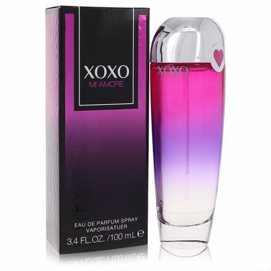 Youthful XOXO Mi Amore 3.4 oz women's perfume. Ombre pink to purple glass bottle with silver heart cap, beside its sleek black box.