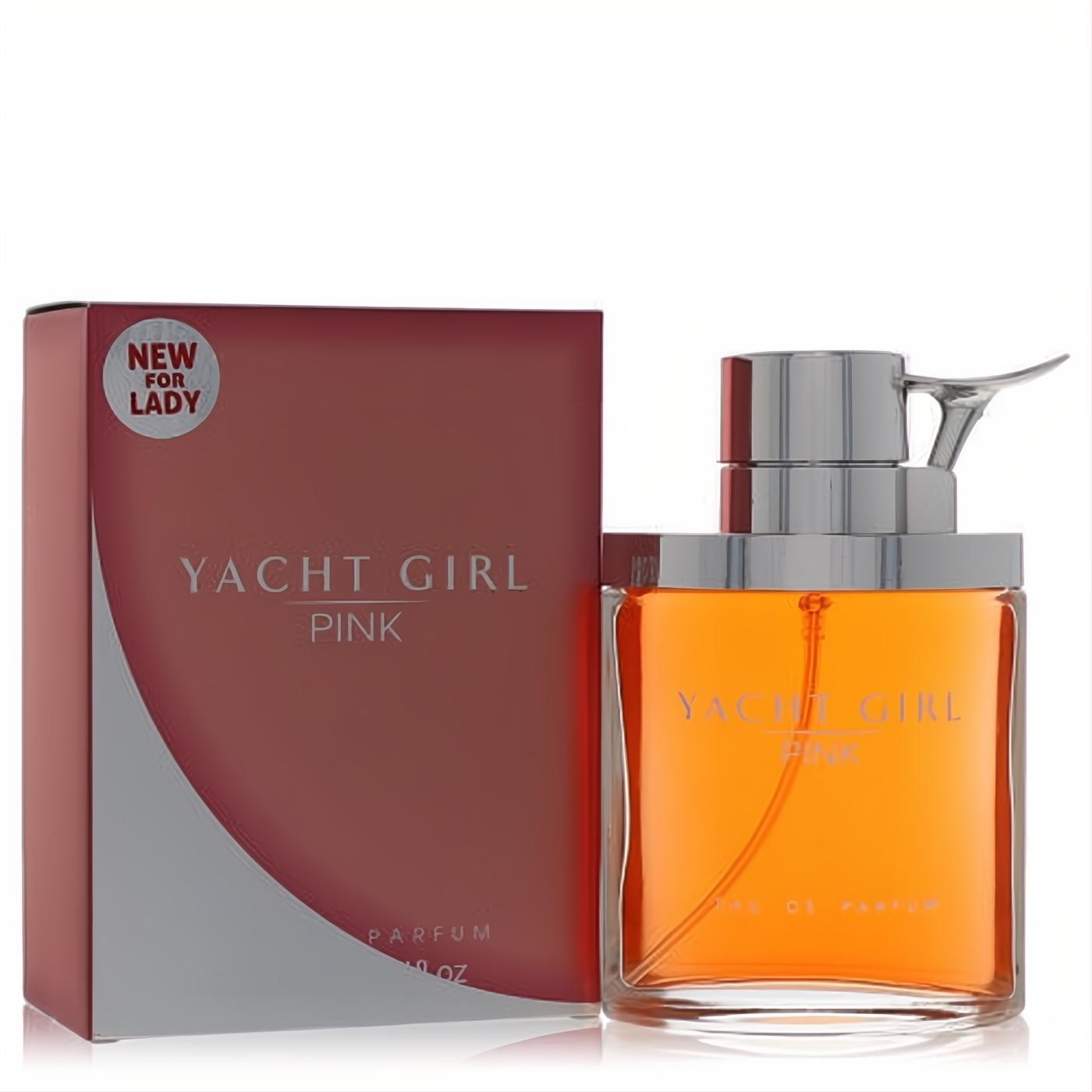 New Yacht Girl Pink 3.4 oz Eau De Parfum. Sleek glass bottle with vibrant orange liquid, unique silver cap, and elegant pink box.